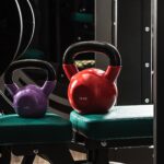 Sports equipment in gym. Dumbbells of different weight close up