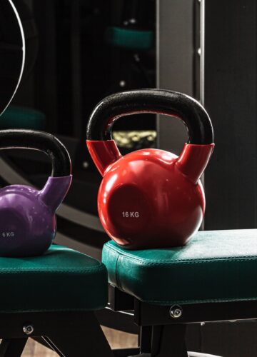 Sports equipment in gym. Dumbbells of different weight close up