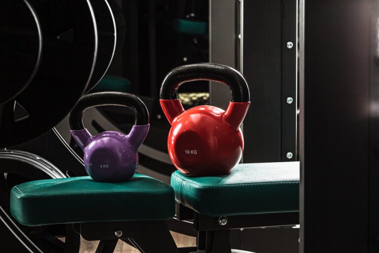 Sports equipment in gym. Dumbbells of different weight close up